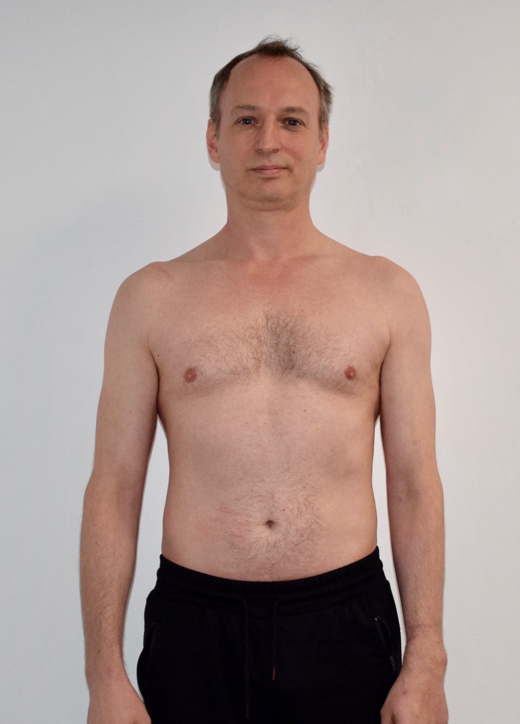 Male body transformation before photo at Roar Fitness personal training studio