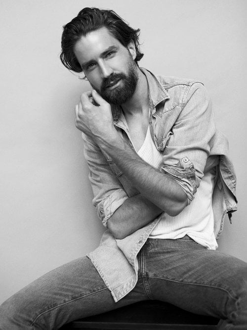 Male client dumbbell training at Roar Fitness with personal trainer