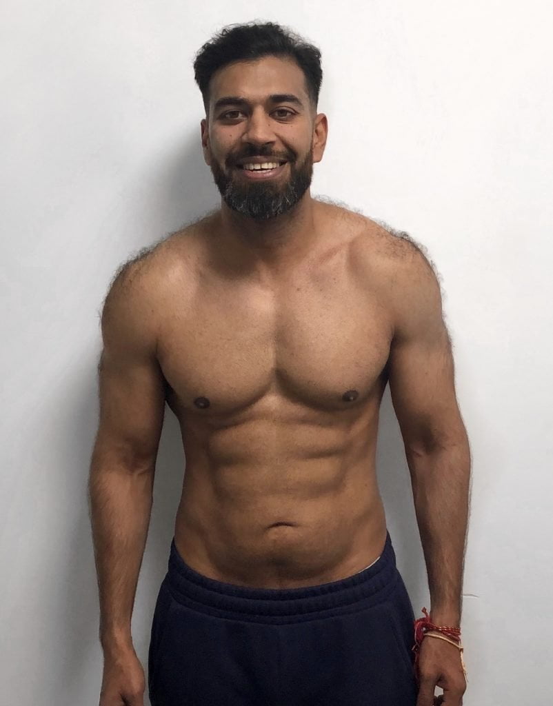 A man after his fitness transformation, showcasing a muscular and toned physique.