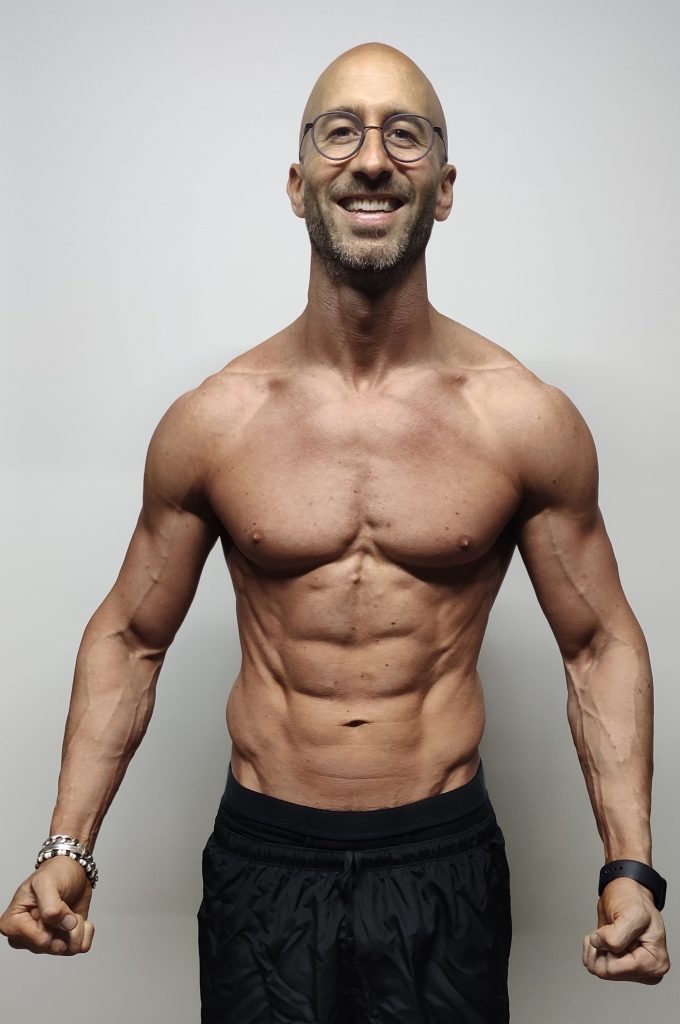 A muscular man after completing a fitness transformation.