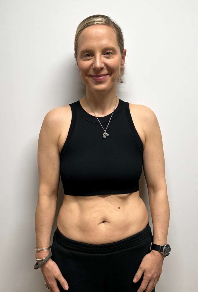Lucy's before photo at the start of her body transformation with Roar Fitness personal training London