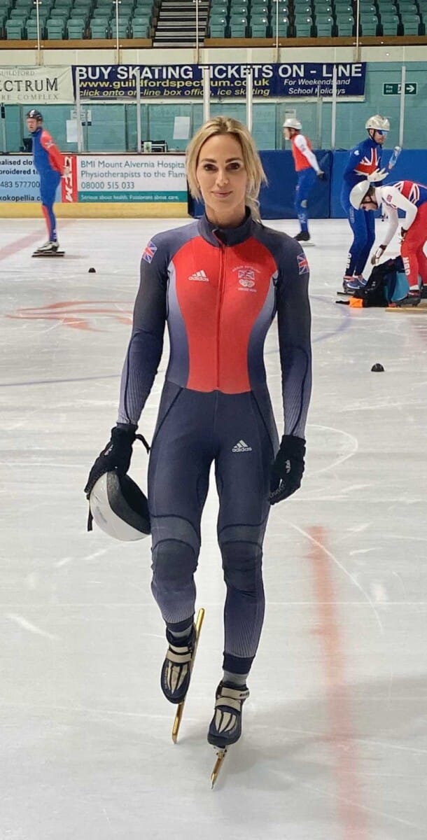 Sarah Lindsay on the ice in a Great Britain short track skinsuit